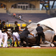 Illustration for article titled It Takes A Village To Secure An Infield Rain Tarp